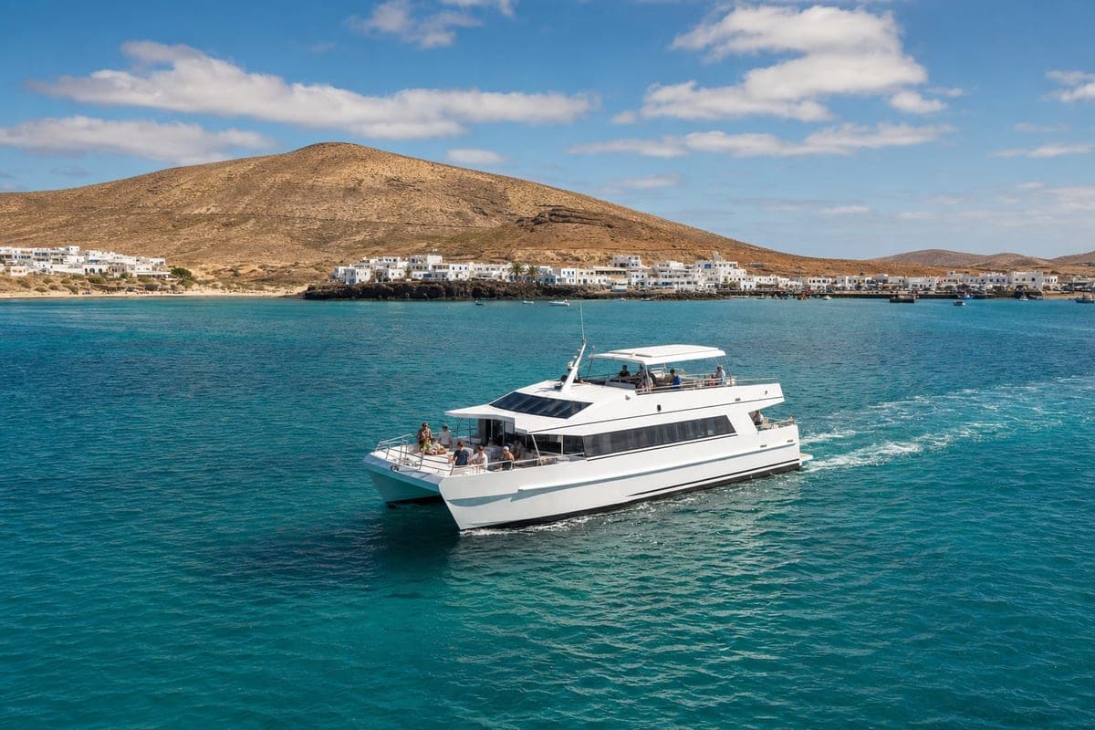 Passenger catamaran cruising toward Caleta de Sebo in La Graciosa