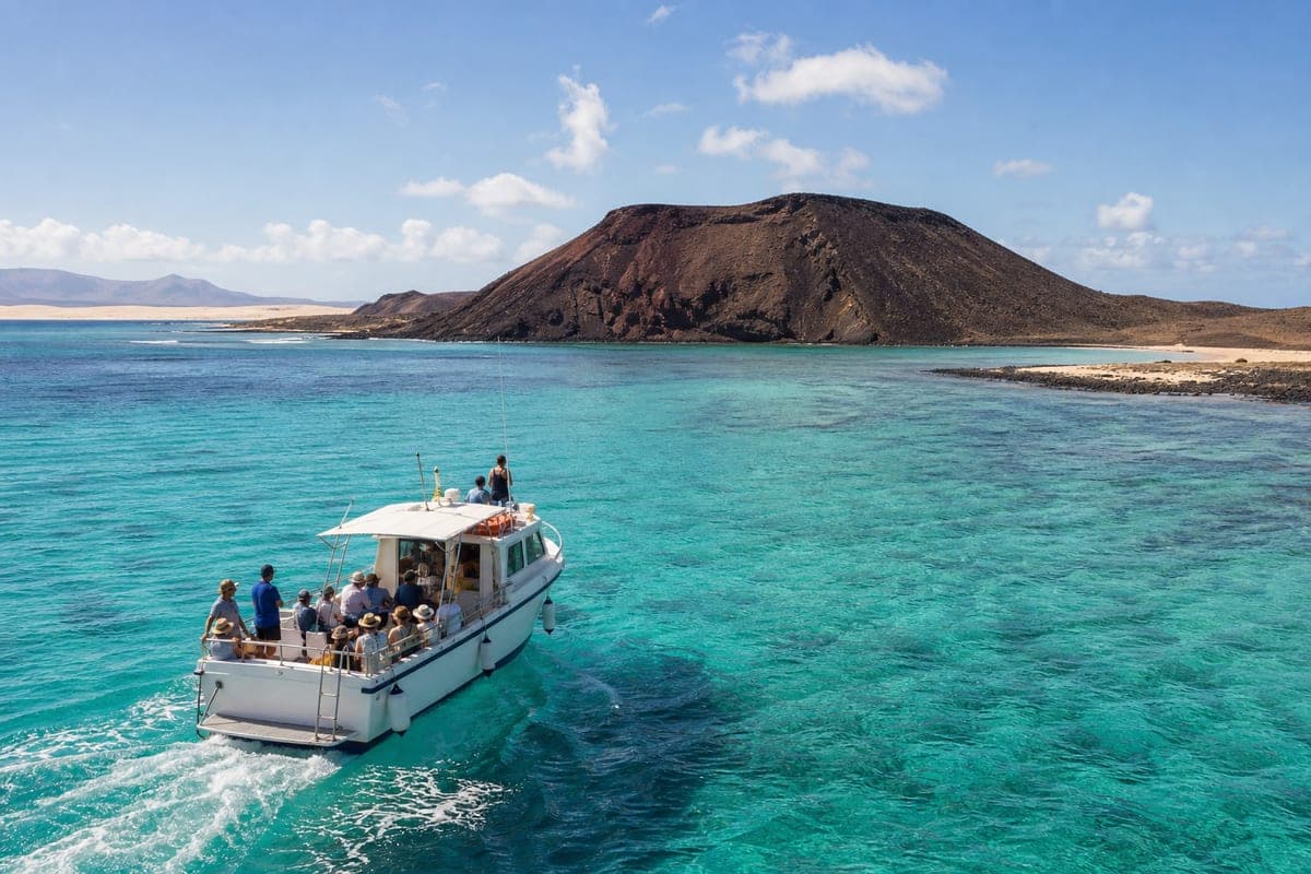 Passenger boat crossing turquoise water from Fuerteventura to Isla de Lobos